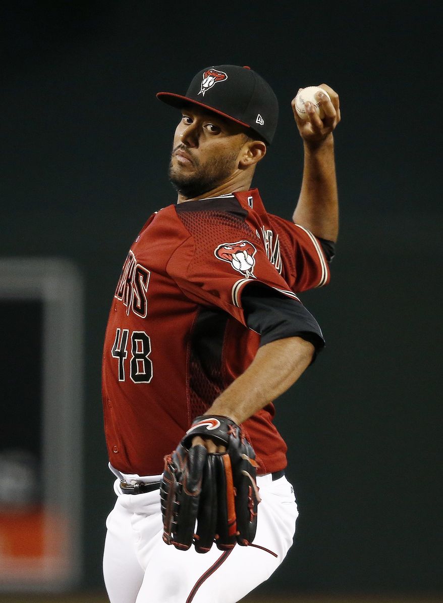 Arizona Diamondbacks' Randall Delgado throws a pitch against the Philadelphia Phillies during the first inning of a baseball game Sunday, June 25, 2017, in Phoenix. (AP Photo/Ross D. Franklin)