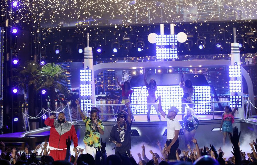 DJ Khaled, from left, Quavo, Lil Wayne, and Chance The Rapper perform "I'm the One" at the BET Awards at the Microsoft Theater on Sunday, June 25, 2017, in Los Angeles. (Photo by Matt Sayles/Invision/AP)