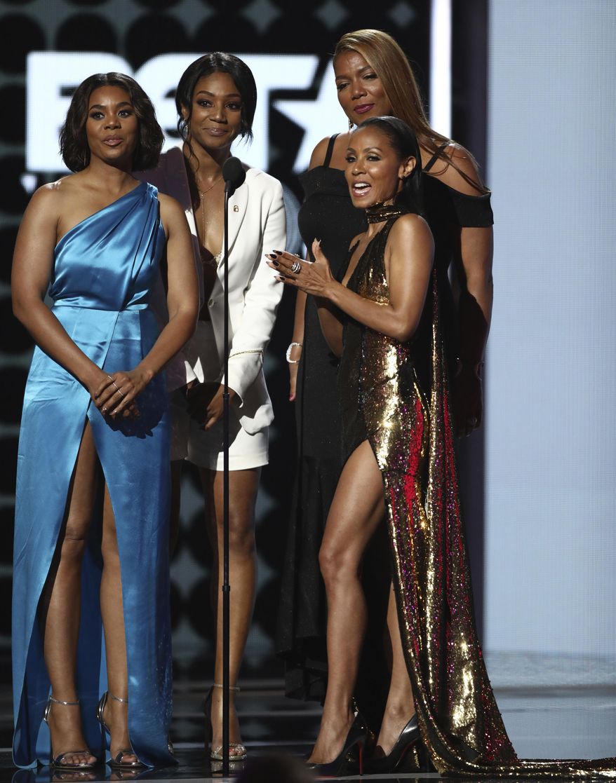 Regina Hall, from left, Tiffany Haddish, Jada Pinkett Smith and Queen Latifah present the lifetime achievement award at the BET Awards at the Microsoft Theater on Sunday, June 25, 2017, in Los Angeles. (Photo by Matt Sayles/Invision/AP)