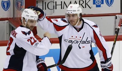 FILE - In this Monday, May 1, 2017, file photo, Washington Capitals&#x27; Kevin Shattenkirk (22) celebrates with T.J. Oshie (77) after scoring the game-winning goal in overtime of Game 3 in an NHL Stanley Cup Eastern Conference semifinal hockey game against the Pittsburgh Penguins in Pittsburgh. The Capitals committed big money to winger T.J. Oshie with a $46 million, eight-year deal, but theyre unlikely to re-sign Shattenkirk, Williams, Karl Alzner and Daniel Winnik. Shattenkirk wants to be a No. 1 defenseman and is a good bet to sign the richest contract of any free agent. (AP Photo/Gene J. Puskar, File)