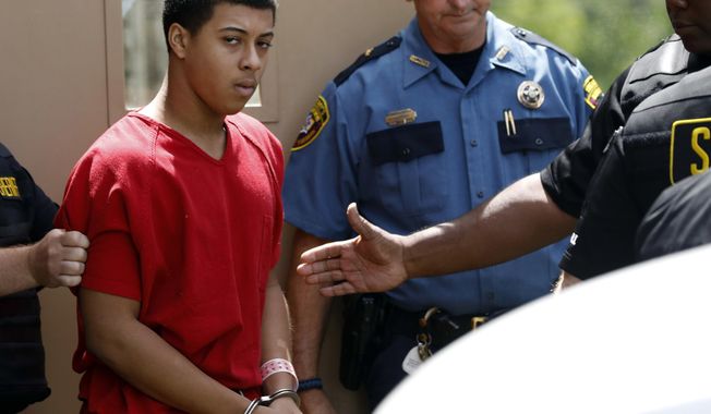 Dwan Wakefield, one of three men charged with murder in connection with the shooting death of Kingston Frazier, leaves the Madison County Justice Court on Monday, June 26, 2017, in Canton, Miss. A judge said there is probable cause to hold Wakefield and the two other Mississippi teenagers in the shooting death. (AP Photo/Rogelio V. Solis)