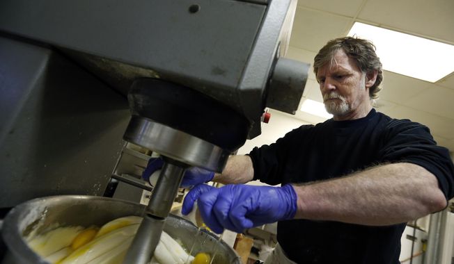 Masterpiece Cakeshop owner Jack Phillips cracks eggs into a cake batter mixer inside his store in Lakewood, Colo. The Supreme Court is taking on a new clash between gay rights and religion in a case about a wedding cake for a same-sex couple in Colorado. The justices said Monday, June 26, 2017, they will consider whether a baker who objects to same-sex marriage on religious grounds can refuse to make a wedding cake for a gay couple.  (AP Photo/Brennan Linsley, File)