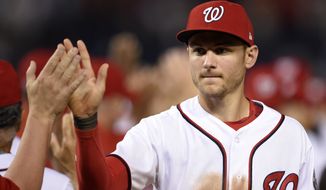 Washington Nationals Trea Turner celebrates 6-1 win over the Chicago Cubs after a baseball game, Tuesday, June 27, 2017, in Washington. (AP Photo/Nick Wass)