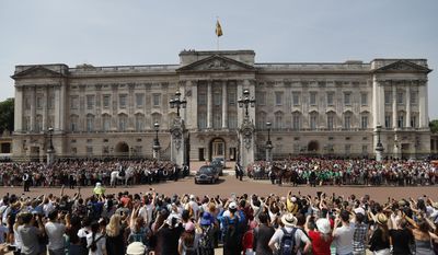 FILE- In this Wednesday, June 21, 2017 file photo, Queen Elizabeth II leaves Buckingham Palace with Prince Charles to travel to parliament for her speech at the official State Opening of Parliament in London. Queen Elizabeth II is set to receive an increase in the official funding she receives each year, Buckingham Palace said Tuesday, June 27, 2017.  (AP Photo/Frank Augstein, File)