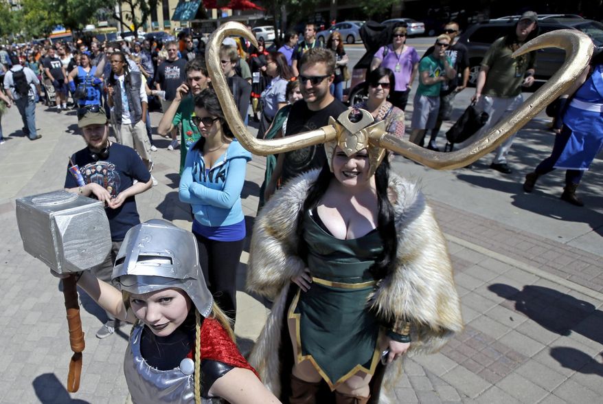 FILE- In this Sept. 4, 2017, file photo, Jessica Nowan, left and Caitlin Grandstaff, right, stand in line for the Salt Lake Comic Con at the Salt Palace Convention Center, in Salt Lake City. Settlement talks have broken down between the organizers of two pop-culture conventions in California and Utah known for guests' elaborate costumes, Salt Lake Comic Con officials said Tuesday, June 27, 2017. Both sides are asking a judge to decide the contest over naming rights, said Bryan Brandenburg, co-founder of Salt Lake Comic Con. (AP Photo/Rick Bowmer, File)