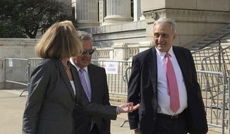 FILE- In this June 22, 2017, file photo, Carl Paladino, right, walks with his lawyers outside the state Department of Education building after the first day of testimony before Education Commissioner MaryEllen Elia, who will decide if Paladino should be removed from his position on the Buffalo Board of Education in Albany, N.Y. Paladino’s accused of disclosing information about teacher contract negotiations discussed in closed-door sessions. The hearing’s expected to conclude Wednesday, June 28. (AP Photo/Mary Esch, File)