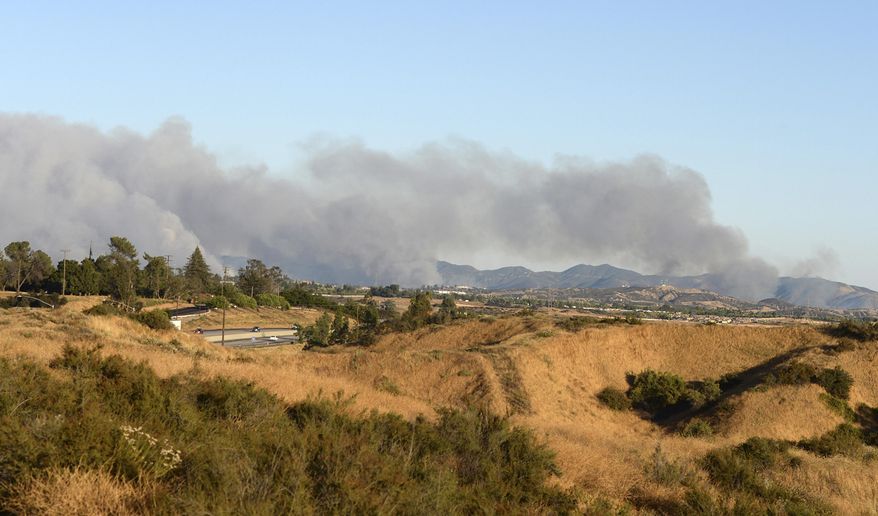 In this photo taken Monday, June 26, 2017, smoke plumes from the Manzanita Fire are seen near Beaumont, Ca. A wildfire in a rugged inland area of Southern California grew substantially overnight. The blaze burning in Riverside County about 80 miles east of Los Angeles is only 10 percent contained Tuesday morning, June 27. Several small communities have been warned to be ready to evacuate. (Micah Escamilla/The Press Enterprise via AP)/The Press-Enterprise via AP)