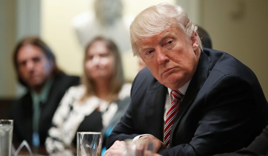 President Trump met Wednesday with what the White House identified as "immigration crime victims" to urge passage of House legislation. (Associated Press)