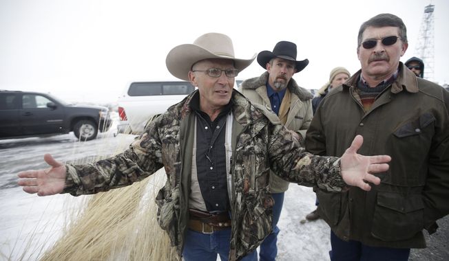 FILE - In this Jan. 9, 2016 file photo, Robert &quot;LaVoy&quot; Finicum, left, a rancher from Arizona, talks to reporters at the Malheur National Wildlife Refuge near Burns, Ore. FBI Special Agent W. Joseph Astarita has been indicted in Portland Ore., Wednesday, June 28, 2017, on accusations that he lied about firing at Finicum when officers arrested leaders of an armed occupation of a federal wildlife refuge in rural Oregon.(AP Photo/Rick Bowmer, File)