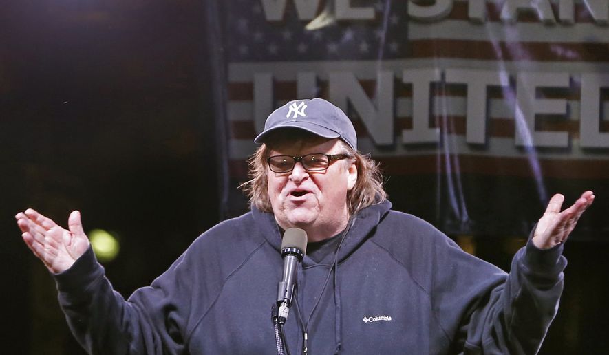 Filmmaker Michael Moore speaks to thousands of people at an anti-Trump rally and protest in front of the Trump International Hotel in New York, Jan. 19, 2017. (AP Photo/Kathy Willens) **FILE**