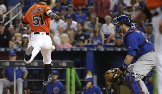 Miami Marlins&#39; Ichiro Suzuki (51) beats the throw to Chicago Cubs catcher Miguel Montero to score on a single hit by Marcell Ozuna during the first inning of a baseball game, Sunday, June 25, 2017, in Miami. (AP Photo/Lynne Sladky)
