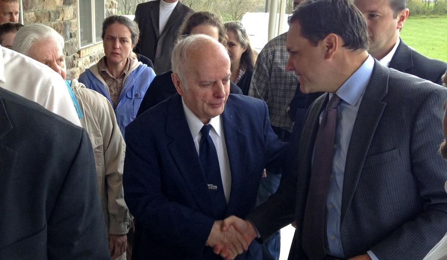 FILE – In this April 19, 2017, file photo, the Rev. Rowland Foster, center, shakes hands with defense attorney Chris Ferro, right, before a court hearing in Bernville, Pa. Foster, the pastor of a church that rejects modern medicine is due in court in Pennsylvania on a charge that he failed to report suspected abuse when his 2-year-old granddaughter died of pneumonia. Foster is scheduled to appear in court on Wednesday, June 28, 2017, for a preliminary hearing that will determine if there’s enough evidence to send the case to trial. (AP Photo/Mark Scolforo, File)