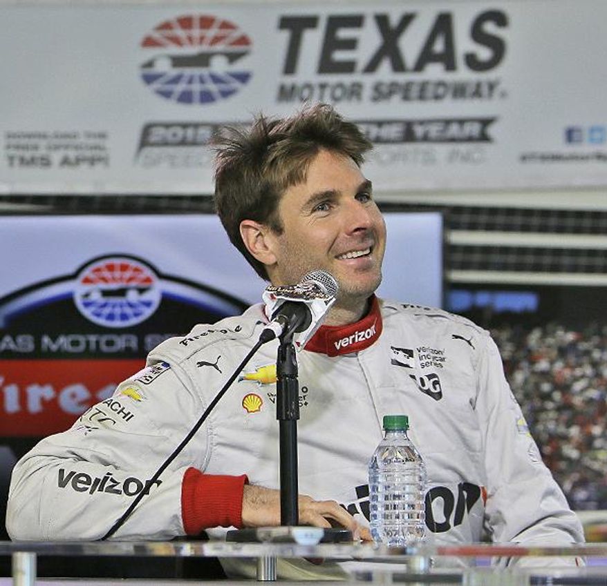 FILE - In this May 3, 2016, file photo, Will Power smiles while speaking to reporters during a break in testing at Texas Motor Speedway in Fort Worth, Texas. Chemistry on and off the track has helped fuel Team Penske’s IndyCar success. All four Penske drivers are sixth or better in the points race. (AP Photo/LM Otero, File)