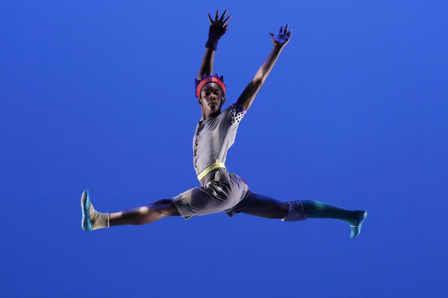 In this June 7, 2017 photo, Ballet Tech public school eighth grader D-Lonzo Callwood performs in "Meshugana Dance," at New York's Joyce Theater. Ballet Tech provides tuition-free dance training along with academics for students in grades 4 through 8, with about 50 fourth-graders admitted each year out of the thousands who audition. (AP Photo/Mark Lennihan)