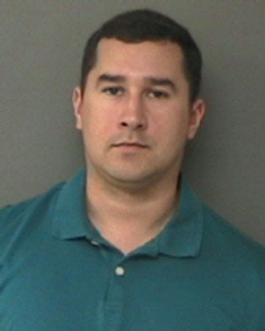 FILE - This Jan. 7, 2016 file photo released by the Waller County Sheriff's Office in Hempstead, Texas, shows former Texas State Trooper Brian Encinia, after his arrest on a perjury charge. The misdemeanor perjury charge has been dismissed against the fired Texas state trooper in a case arising from his 2015 arrest of Sandra Bland, a black woman who was later found dead in a county jail. (Waller County Sheriff's Office via AP, File)