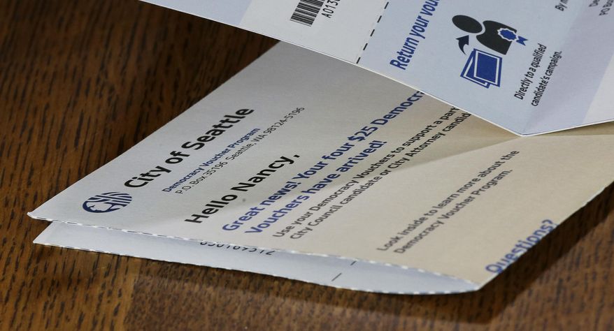 A City of Seattle Democracy Voucher belonging to the wife of Mark Elster rests on a table, Wednesday, June 28, 2017, in Seattle. Elster is a plaintiff in a new lawsuit challenging Seattle&#39;s first-in-the-nation voucher system for publicly financing political campaigns. (AP Photo/Ted S. Warren)
