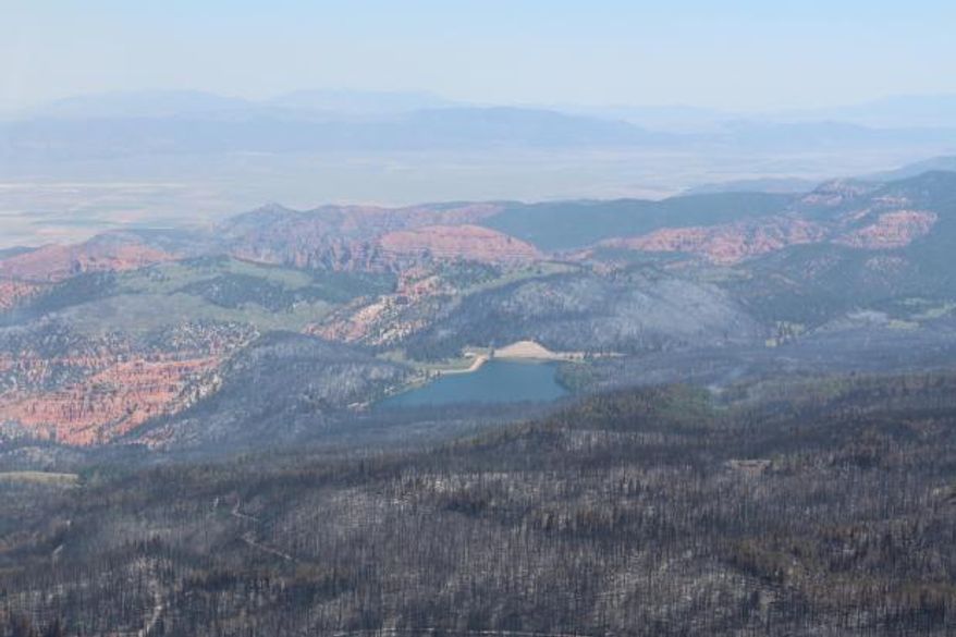 This Tuesday, Jan. 27, 2017, photo taken by Tim Roide, Incident Commander, shows an aerial view of burnout area around Yankee Meadow, in southern Utah. In Utah, firefighters hope Wednesday, June 28, 2017, to douse areas with intense blazes at the Utah fire's southern end so residents can return to homes in the town of Brian Head. Homes there have been evacuated since June 17 since authorities said the fire was started by someone using a torch tool to burn weeds on private land. (Tim Roide/Great Basin Incident Management Type 2 Team, Team 4, via AP)