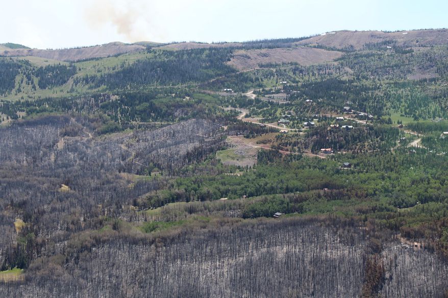 This Tuesday, Jan. 27, 2017, photo taken by Tim Roide, Incident Commander, shows an aerial view of burnout areas around Brian Head, Utah. In Utah, firefighters hope Wednesday, June 28, 2017, to douse areas with intense blazes at the Utah fire's southern end so residents can return to homes in the town of Brian Head. Homes there have been evacuated since June 17 since authorities said the fire was started by someone using a torch tool to burn weeds on private land. (Tim Roide/Great Basin Incident Management Type 2 Team, Team 4, via AP)