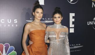 In this Jan. 8, 2017 file photo, Kendall Jenner, left, and Kylie Jenner arrive at the NBCUniversal Golden Globes afterparty at the Beverly Hilton Hotel in Beverly Hills, Calif. Kendall and Kylie Jenner apologized Thursday, June 29, 2017, for &amp;quot;vintage&amp;quot; T-shirts superimposing their images with those of famous musicians, including Ozzy Osbourne, Tupac and the Notorious B.I.G. The sisters began selling the shirts Wednesday online for $125 each as part of their Kendall + Kylie brand. (Photo by Rich Fury/Invision/AP, File)