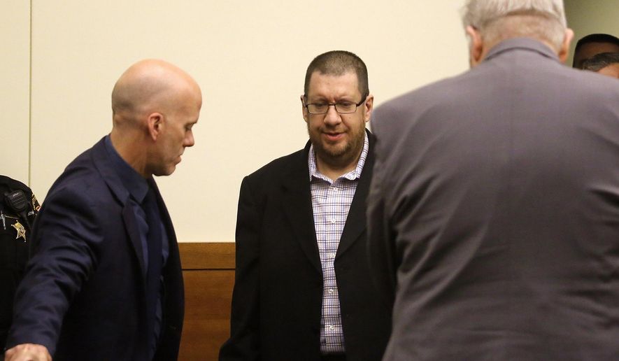 FILE - In this Thursday, June 22, 2017, file photo, Lincoln Rutledge, center, appears with his attorneys Mitch Williams, left, and Jefferson Liston, right shortly before the verdict in Columbus, Ohio. A jury on Thursday, June 29, recommended life in prison without parole for Rutledge, convicted of fatally shooting an Ohio SWAT officer during a standoff. (Tom Dodge/The Columbus Dispatch via AP, File)