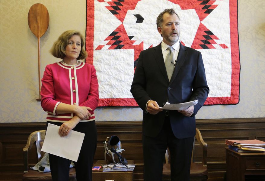 Democratic Sen. Christine Rolfes and Sen. Kevin Ranker talk to the media about the agreement reached on education funding, Thursday, June 29, 2017 in Olympia, Wash. Lawmakers say their budget compromise satisfies a state Supreme Court ruling that says the state must spend more money on schools. (AP Photo/Rachel La Corte)