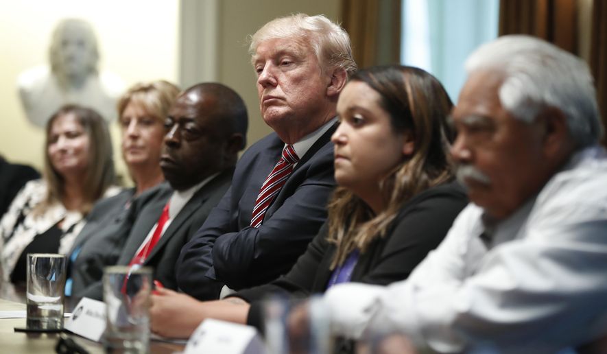 President Donald Trump meets with what the White House identifies as &amp;quot;immigration crime victims&amp;quot; to urge passage of House legislation to save American lives, Wednesday, June 28, 2017, in the Cabinet Room at the White House in Washington. (AP Photo/Manuel Balce Ceneta)