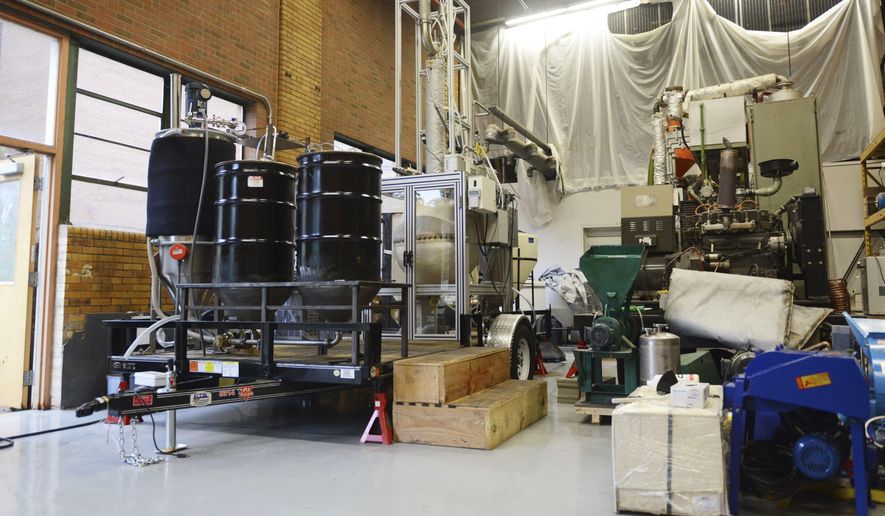 ADVANCE FOR SATURDAY JULY 2017--This machine, which is hitched to a trailer and taken to a wastewater treatment facility in Rosemount, converts pond scum into biodiesel, is seen on Thursday, June 22, 2017 at the Biosystems and Agricultural Engineering Building in St. Paul. The goal of the research is to streamline the disposal process of scum, which maximizing biodiesel output, moving toward zero waste when treating water. (Ellen Schmidt /The Minnesota Daily via AP)