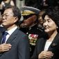 South Korean President Moon Jae-in, left, with his wife Kim Jung-sook, and Marine Corps Commandant Gen. Robert B. Neller, center, place their hands over their hard during the playing of national anthems for South Korea and the United States during a ceremony at the &amp;quot;Chosin Few Battle Monument,&amp;quot; at the National Museum of the Marine Corps, Wednesday, June 28, 2017, in Triangle, Va. (AP Photo/Alex Brandon)