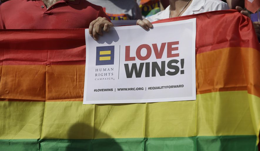 FILE - In this June 29, 2015, file photo, supporters of the U.S. Supreme Courts ruling on same-sex marriage gather on the steps of the Texas Capitol for a news conference celebrating marriage equality and looking to important work ahead in Austin, Texas. Gay spouses may not be entitled to government-subsidized workplace benefits, the Texas Supreme Court ruled Friday, June 30, 2017, in a unanimous decision quickly condemned by gay-rights groups. The court overturned a lower court's decision that favored same-sex marriage benefits, ordering the issue back to trial. Social conservatives hope the case will help them chip away at the landmark U.S. Supreme Court ruling that legalized gay marriage. (AP Photo/Eric Gay, File)