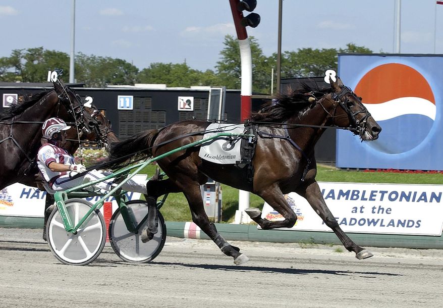 FILE - In this Aug. 5, 2006, file photo, Glidemaster, driven by John Campbell, wins the Hambletonian at Meadowlands Racetrack in East Rutherford, N.J. Campbell bids farewell to the Meadowlands, making his final drives at the track that helped the Hall of Famer become harness racing's career leader in purses. The 62-year-old Campbell is scheduled to drive in five races at the Meadowlands Racetrack on Friday night, June 30, 2017. (AP Photo/Bill Kostroun, File)