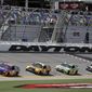 Denny Hamlin (11) leads Matt Kenseth (20) , Kyle Busch (18) and Martin Truex Jr. (78) though a lap during a NASCAR cup auto racing practice at Daytona International Speedway, Thursday, June 29, 2017, in Daytona Beach, Fla. (AP Photo/John Raoux)