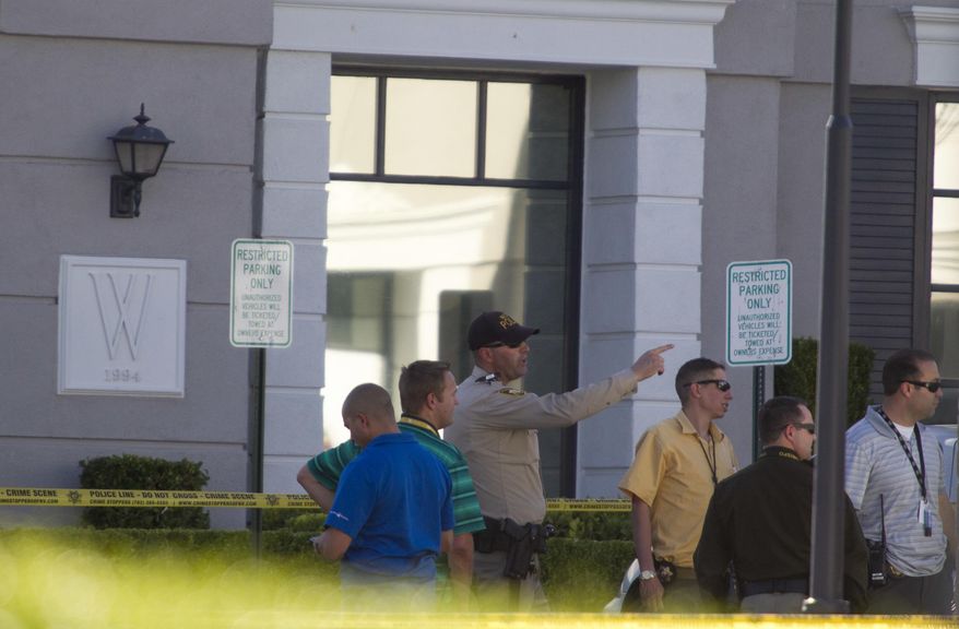 Las Vegas police investigate a shooting at a pain-management in Las Vegas, Thursday, June 29, 2017. A patient denied a same-day appointment at the clinic shot and injured two employees Thursday before fatally shooting himself, police said. (Richard Brian/Las Vegas Review-Journal via AP)