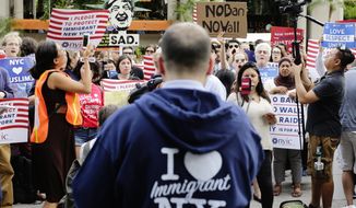 Protesters of a travel ban gather in Union Square, Thursday, June 29, 2017, in New York. A scaled-back version of President Donald Trump&#39;s travel ban takes effect Thursday evening, stripped of provisions that brought protests and chaos at airports worldwide in January yet still likely to generate a new round of court fights. (AP Photo/Frank Franklin II)