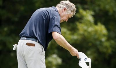Michael Allen tips his visor and bows after making a birdie on the 17th hole during the second round of the U.S. Senior Open golf tournament, Friday, June 30, 2017, in Peabody, Mass. (AP Photo/Michael Dwyer)