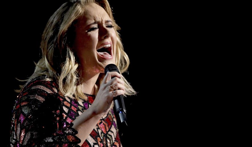FILE - In this Feb. 12, 2017, file photo, Adele performs "Hello" at the 59th annual Grammy Awards in Los Angeles. Pop superstar Adele has hinted that her current tour for Grammy-winning album "25" will be her last. The 29-year-old included a signed, handwritten note in the program for her Wednesday June 28, 2017, show at Wembley Stadium in London stating, "I don't know if I'll ever tour again and so I want my last time to be at home." (Photo by Matt Sayles/Invision/AP, File)