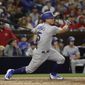 Los Angeles Dodgers&#x27; Austin Barnes watches his three-run home run during the sixth inning of the team&#x27;s baseball game against the San Diego Padres on Friday, June 30, 2017, in San Diego. (AP Photo/Gregory Bull)