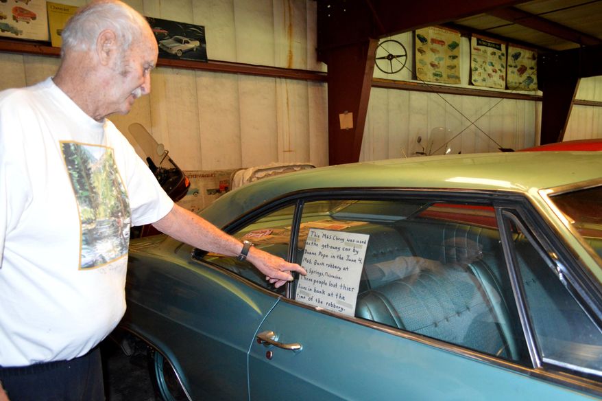 In this June 2017 photo, Monty Hollertz, 84, displays dozens of rare classic cars at Chevyland USA, the classic car museum off Interstate 80 near Elm Creek, Neb. Hollertz has among his collection the 1965 Chevy getaway car driven by Duane Earl Pope during one of the deadliest bank robberies in Nebraska history. (Angelica Leicht/The Daily Hub via AP)