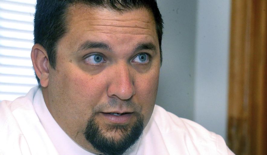 ADVANCE FOR SATURDAY JULY 2 AND THEREAFTER - In a Tuesday June 27, 2017 photo, Rutherford County Sheriff's Detective Steven Kohler talks about reopening a cold case file on the death of Stanley Smith from 1977, at the Rutherford County Sheriff's office, in Murfreesboro, Tenn. The Rutherford County Sheriff’s Department and the TBI are asking for the public’s help in the new investigation of a 40-year-old cold case. (Helen Comer/The Daily News Journal via AP)
