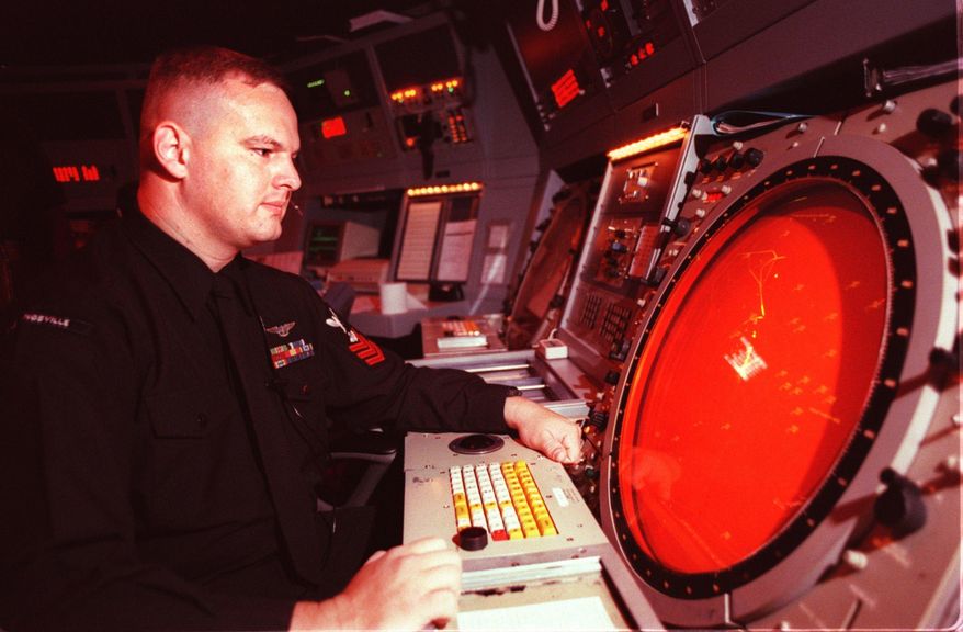 This March 4, 1999 photo shows an air traffic controller in the tower in NAS Kingsville, in Kingsville, Texas. The base was commissioned 75 years ago on July 4, 1942. (Corpus Christi Caller-Times via AP)