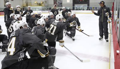 Players listen to Rocky Thompson, coach for the Vegas Golden Knights&#39; American Hockey League affiliate, the Chicago Wolves, during the Golden Knights&#39; NHL hockey development camp at Las Vegas Ice Center in Las Vegas on Thursday, June 29, 2017. (Bizuayehu Tesfaye/Las Vegas Review-Journal via AP)