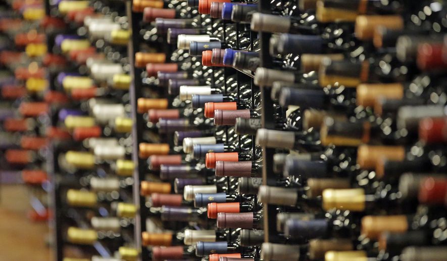 FILE - In this June 16, 2016, file photo, bottles of wine are displayed during a tour of a state liquor store, in Salt Lake City. (AP Photo/Rick Bowmer, File)