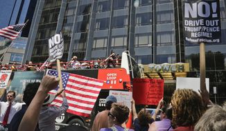 Protesters rally outside a Trump hotel to call for the impeachment of President Trump, Sunday July 2, 2017, in New York. A statement from the organizer&#x27;s website said President Trump &quot;has been in blatant violation of the Constitution&quot; and that the House of Representatives has the power to impeach him. (AP Photo/Bebeto Matthews)