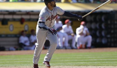 Atlanta Braves&#39; Matt Kemp watches his RBI double hit off Oakland Athletics&#39; Daniel Coulombe in the eleventh inning of a baseball game, Sunday, July 2, 2017, in Oakland, Calif. (AP Photo/Ben Margot)