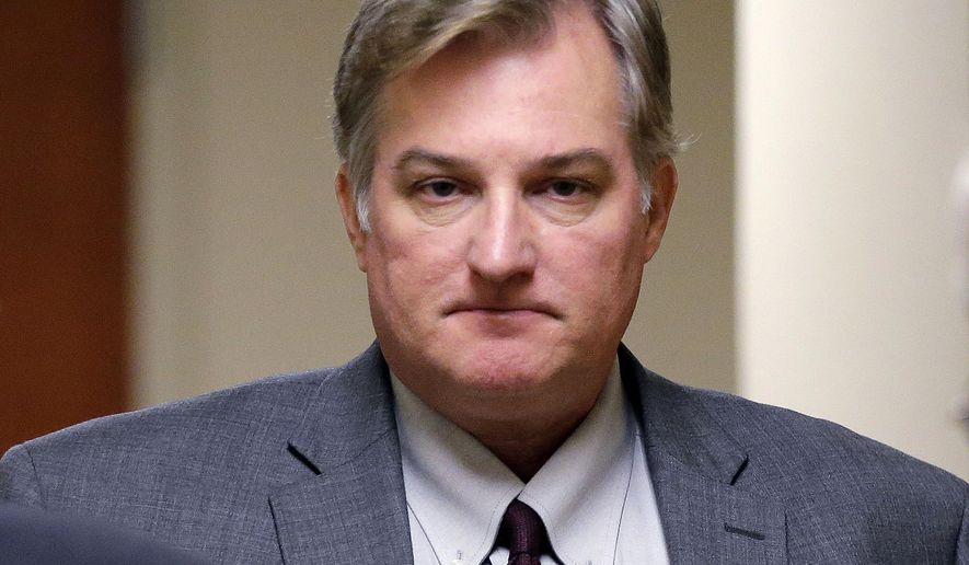 In this Thursday, June 29, 2017, photo, former Tulsa Police officer Shannon Kepler exits the courtroom during his trial at the Tulsa County Courthouse, in Tulsa, Okla. Kepler, who accused of fatally shooting his daughter's boyfriend in 2014, is on trial this week for the third time after jurors in the first two trials couldn't decide whether he was guilty of first-degree murder. (Cory Young/Tulsa World via AP)