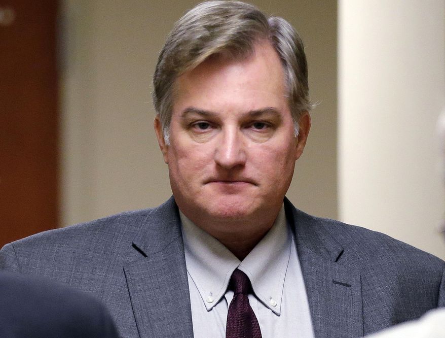 In this Thursday, June 29, 2017, photo, former Tulsa Police officer Shannon Kepler exits the courtroom during his trial at the Tulsa County Courthouse, in Tulsa, Okla. Kepler, who accused of fatally shooting his daughter's boyfriend in 2014, is on trial this week for the third time after jurors in the first two trials couldn't decide whether he was guilty of first-degree murder. (Cory Young/Tulsa World via AP)