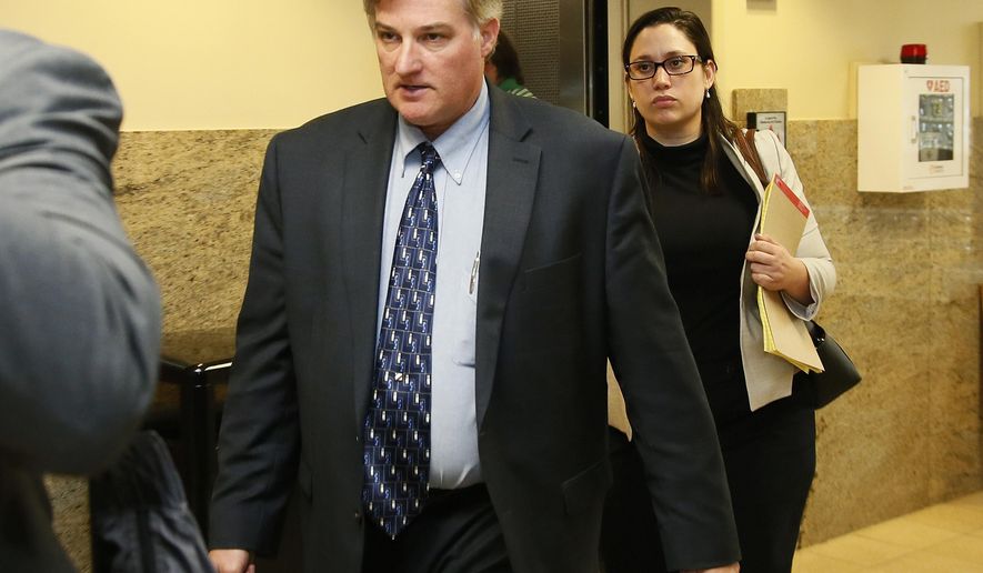 In this Friday, June 30, 2017 photo, Shannon Kepler, left, arrives with his legal team for afternoon testimony in his trial in Tulsa, Okla. Kepler, a former Oklahoma police officer who fatally shot his daughter's black boyfriend in 2014 is on trial for the third time after jurors in previous trials couldn't decide whether or not to convict him of first-degree murder. (AP Photo/Sue Ogrocki)