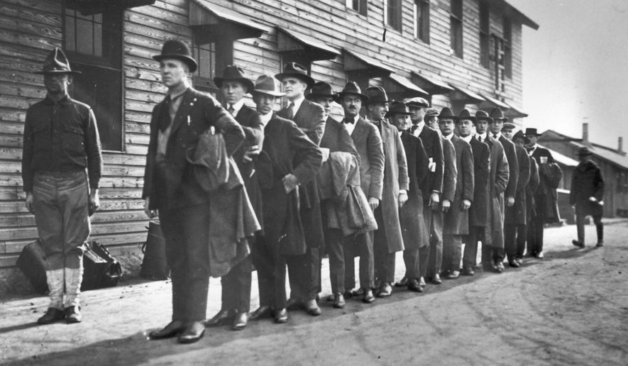 Recruits line up at a New York army camp shortly after Pres. Woodrow Wilson declared war on Germany, April 1917.  (AP Photo)