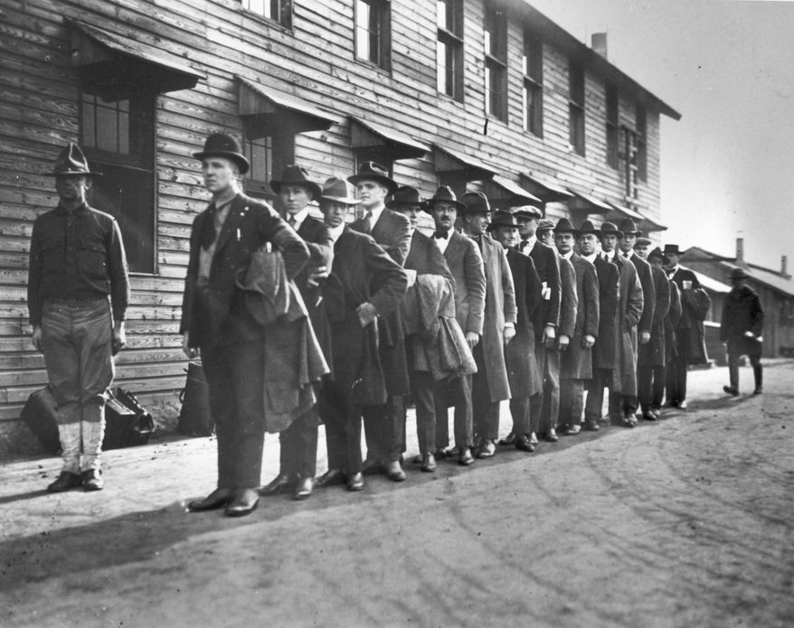 Recruits line up at a New York army camp shortly after Pres. Woodrow Wilson declared war on Germany, April 1917.  (AP Photo)