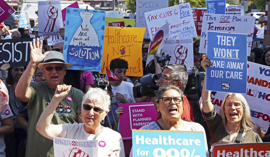Doctors, nurses, health care workers and patients who will lose access to health care or see costs rise attend a rally against the GOP health care bill at Harbor-UCLA Medical Center in Torrance, Calif., Monday, July 3, 2017. (AP Photo/Reed Saxon)