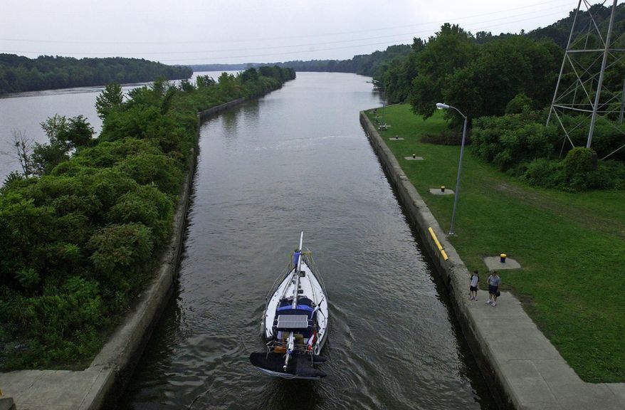 FILE - In this Aug, 20, 2006 file photo, a sail boat heads east on the Erie Canal after exiting Lock 7 in Niskayuna, N.Y. Ground was broken for the Erie Canal 200 years ago, and when the 363-mile canal fully opened in 1825, it was the greatest engineering feat of the era and one that would change history. (Paul Buckowski/The Albany Times Union via AP, File)